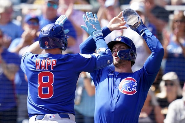The Cubs' Ian Happ is greeted by Nico Hoerner after hitting a two-run home run during the first inning against the Pirates on Wednesday, Sept. 17, 2025, in Pittsburgh. (AP Photo/Matt Freed)
