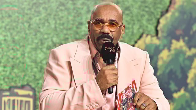 ATLANTA, GEORGIA - AUGUST 23: Steve Harvey speaks onstage during day 2 of Invest Fest 2025 at Georgia World Congress Center on August 23, 2025 in Atlanta, Georgia. (Photo by Paras Griffin/Getty Images)