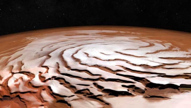 Perspective view of Mars’ north polar ice cap and its distinctive dark troughs forming a spiral-like pattern. The view is based on images taken by ESA’s Mars Express and generated using elevation data from the Mars Orbiter Laser Altimeter on board NASA’s Mars Global Surveyor. Image credit: ESA / DLR / FU Berlin / NASA / MGS / MOLA Science Team.