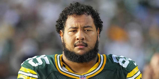 Sep 7, 2025; Green Bay, Wisconsin, USA;  Green Bay Packers guard Aaron Banks (65) during the game against the Detroit Lions at Lambeau Field. Mandatory Credit: Jeff Hanisch-Imagn Images