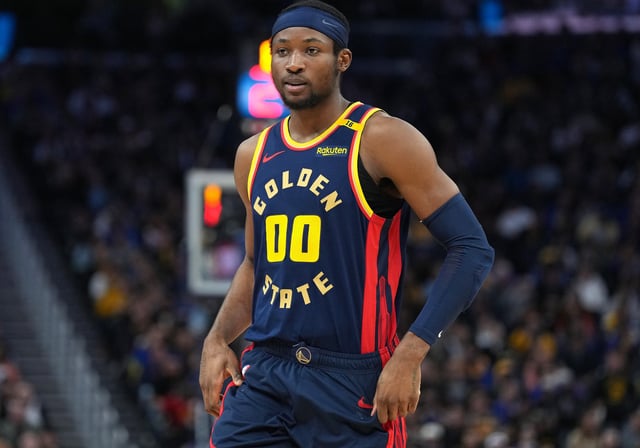 Jonathan Kuminga #00 of the Golden State Warriors looks on against the Sacramento Kings during the third quarter of an NBA basketball game at Chase Center on March 13, 2025 in San Francisco, California.