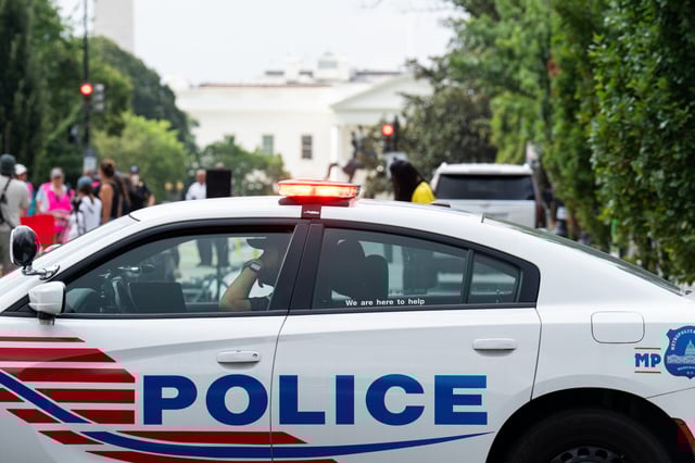 A Washington Metropolitan Police Department patrol car stands watch near a Free DC protest in August.