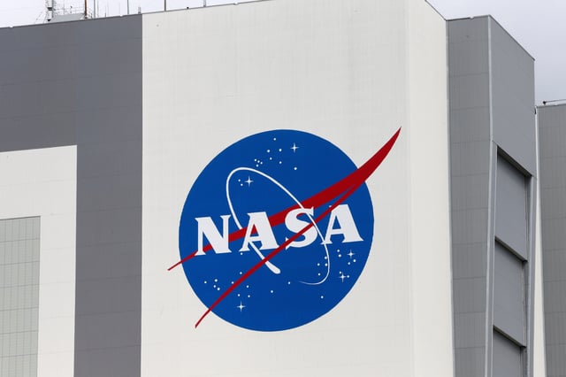 The NASA logo is seen at Kennedy Space Center ahead of the NASA/SpaceX launch of a commercial crew mission to the International Space Station in Cape Canaveral, Florida, U.S., April 16, 2021. REUTERS/Joe Skipper/File Photo