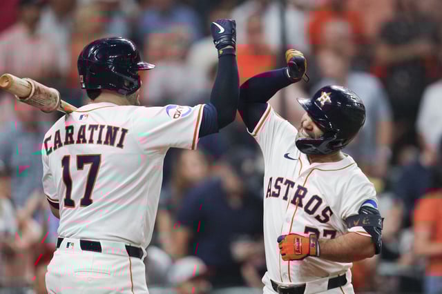 Jose Altuve celebrates with Astros teammate Victor Caratini after his two-run homer to put Houston ahead in the third inning Wednesday at Daikin Park.