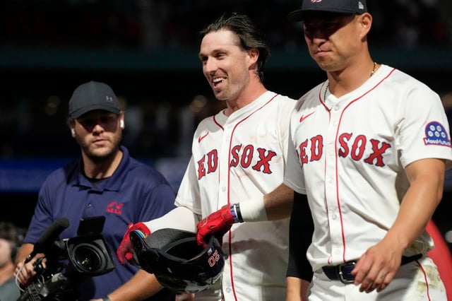 Boston Red Sox Nick Sogard, center, celebrates after driving in the winning run in the tenth inning against the Athletics in a baseball game, Wednesday, Sept. 17, 2025, in Boston. (AP Photo/Robert F. Bukaty)