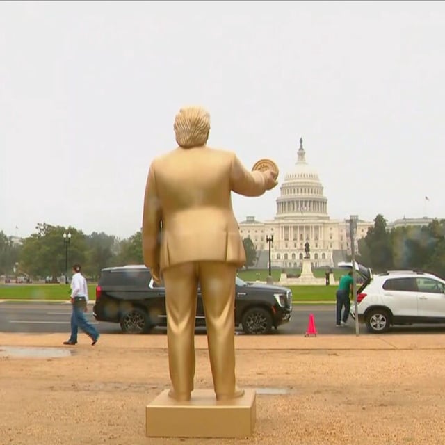 A visually striking 12-foot statue of President DonaldTrump holding a Bitcoin was unveiled outside the Capitol Building on 3rd Street on Wednesday. (7News)