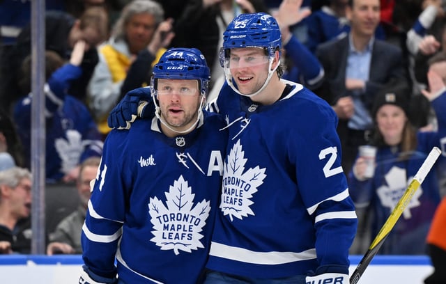 Morgan Rielly and Brandon Carlo of the Toronto Maple Leafs (Dan Hamilton-Imagn Images)