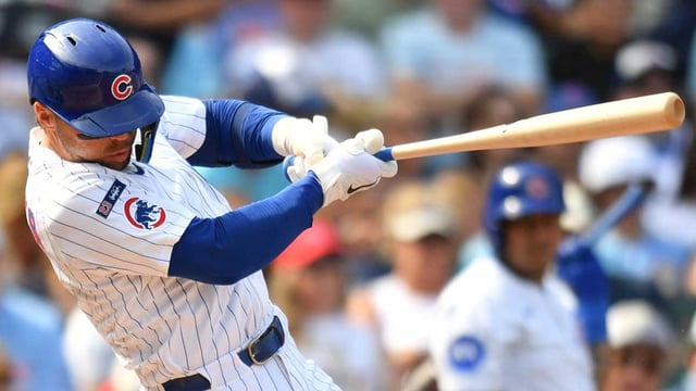 Sep 13, 2025; Chicago, Illinois, USA; Chicago Cubs second baseman Nico Hoerner (2) hits a single against the Tampa Bay Rays during a game at Wrigley Field. Mandatory Credit: Patrick Gorski-Imagn Images