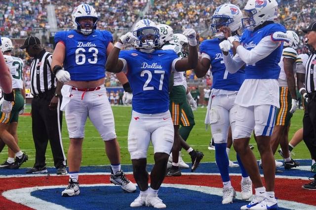 Former UCLA running back T.J. Harden (27) celebrates his rushing touchdown with his SMU teammates during the first half against Baylor on Sept. 6, 2025, in Dallas. (AP Photo/LM Otero)