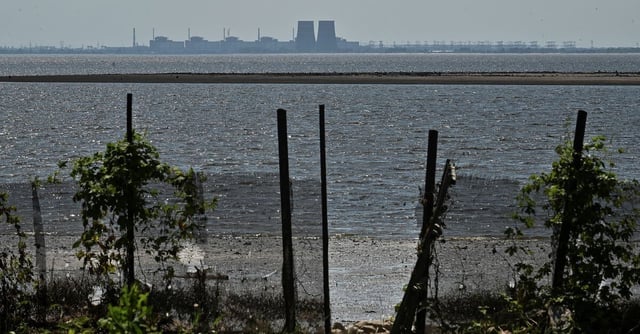 A view shows Zaporizhzhia Nuclear Power Plant from the bank of Kakhovka Reservoir near the town of Nikopol after the Nova Kakhovka dam breached, amid Russia's attack on Ukraine, in Dnipropetrovsk region, Ukraine June 9, 2023. REUTERS/Stringer