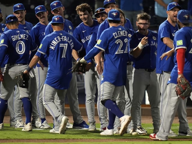 Toronto Blue Jays players celebrate after defeating the Tampa Bay Rays during a baseball game Monday, Sept. 15, 2025, in Tampa, Fla.