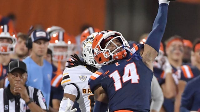 Sep 13, 2025; Champaign, Illinois, USA; Illinois Fighting Illini defensive back Xavier Scott (14) deflects a pass intended for Western Michigan Broncos wide receiver Aveion Chenault (18) during the second half at Memorial Stadium. Mandatory Credit: Ron Johnson-Imagn Images