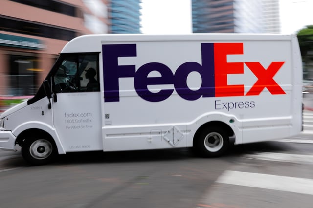A FedEx truck is driven through downtown in Los Angeles, California, U.S., July 22, 2019. REUTERS/Mike Blake/File Photo