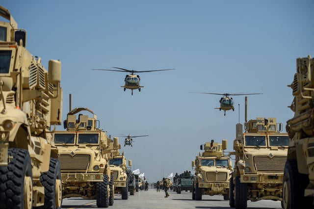 Taliban military helicopters fly to celebrate the third anniversary of Taliban's takeover of Afghanistan, at the Bagram Air Base, in Bagram, Parwan province on August 14, 2024. Taliban authorities kicked off celebrations of the third anniversary of their rule over Afghanistan on August 14, at the former US Bagram air base. (Photo by Ahmad SAHEL ARMAN / AFP) (Photo by AHMAD SAHEL ARMAN/AFP via Getty Images)
