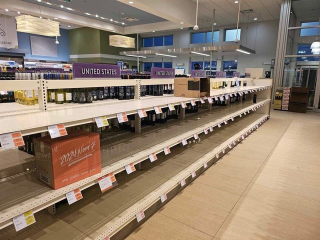  Empty shelves where alcohol and wine from the United States used to be was empty March 5 at the NSLC in Sydney.