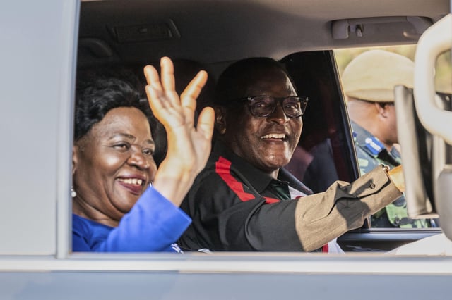 Malawi President Lazarus Chakwera, right, and his wife wave during a campaign rally in Blantyre, Malawi, Sunday, Sept. 7, 2025. (AP Photo/Thoko Chikondi)