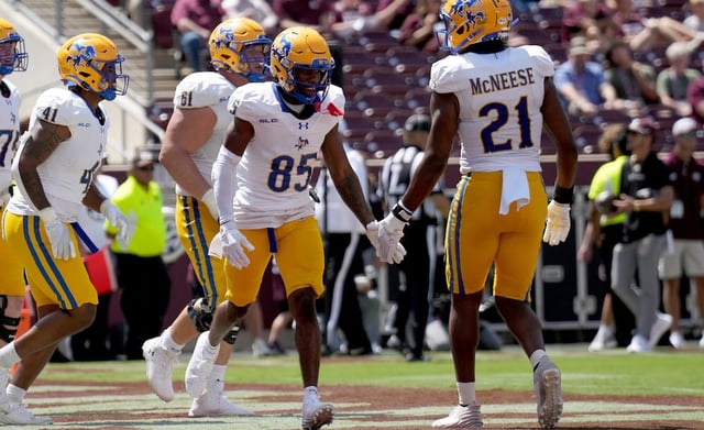 McNeese State wide receiver Jalen Wright (85) reacts with teammate tight end Logan Mauldin (21) after scoring a touchdown against Texas A&M during game Saturday, Sept. 7, 2024, in College Station, Texas.