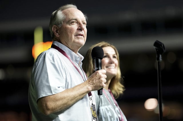 Texas A&M University President Mark A. Welsh, left, addresses the crowd inside Kyle Field as his wife Betty looks on during Midnight Yell in College Station, Texas, Saturday, Aug. 30, 2025. (AP Photo/Sam Craft, File)