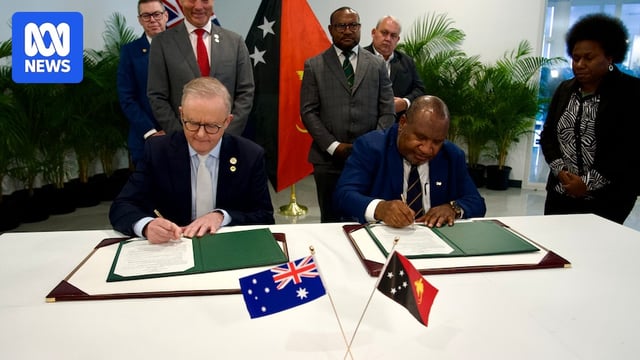Anthony Albanese and James Marape signing