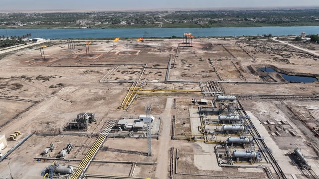 A drone view shows flames emerging from flare stacks at Nahr Bin Omar oilfield, in Basra, Iraq September 18, 2025. REUTERS/Mohammed Aty