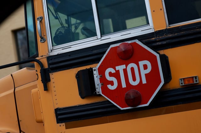 A stop sign attached to a school bus is shown on April 19, 2023, in Miami, Florida.  (Joe Raedle/Getty Images/TNS)