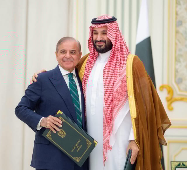 Saudi Crown Prince Mohammed bin Salman and Pakistan Prime Minister Shehbaz Sharif embrace each other on the day they sign a defence agreement, in Riyadh, Saudi Arabia, September 17, 2025. Saudi Press Agency/Handout via REUTERS