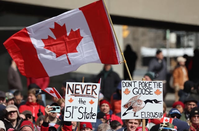 Hundreds gather in Toronto to protest Donald Trump’s comments about Canada becoming the 51st state of the United States, March 22, 2025. (Steve Russell/Toronto Star via Getty Images)