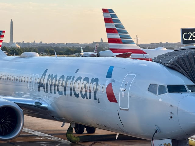 An American Airlines passenger plane is parked at a gate at Ronald Reagan Washington National Airport on August 24, 2025, in Arlington, Virginia. (Photo by Daniel SLIM / AFP) (Photo by DANIEL SLIM/AFP via Getty Images)