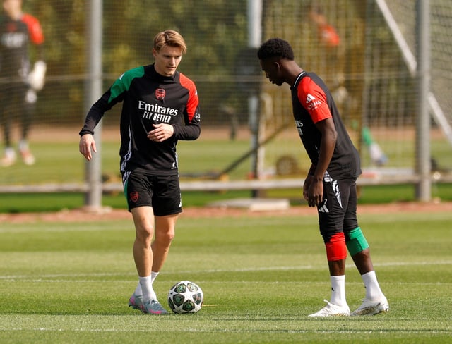 Soccer Football - Champions League - Arsenal Training - Arsenal Training Centre, London Colney, Britain - April 28, 2025 Arsenal's Martin Odegaard with Bukayo Saka during training Action Images via Reuters/Andrew Couldridge/File Photo