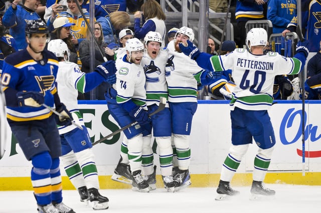 Vancouver Canucks Brock Boeser celebrates with Jake DeBrusk, Filip Hronek and Elias Pettersson (Jeff Curry-Imagn Images)
