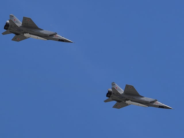 (FILES) This file photo taken on May 9, 2018 shows Russia's MiG-31 supersonic interceptor jets carrying hypersonic Kinzhal (Dagger) missiles flying over Red Square during the Victory Day military parade in Moscow. - Russia used its newest Kinzhal hypersonic missiles for the first time in Ukraine on March 18, 2022 to destroy a weapons storage site in the country's west, the defence ministry said on March 19. (Photo by AFP)