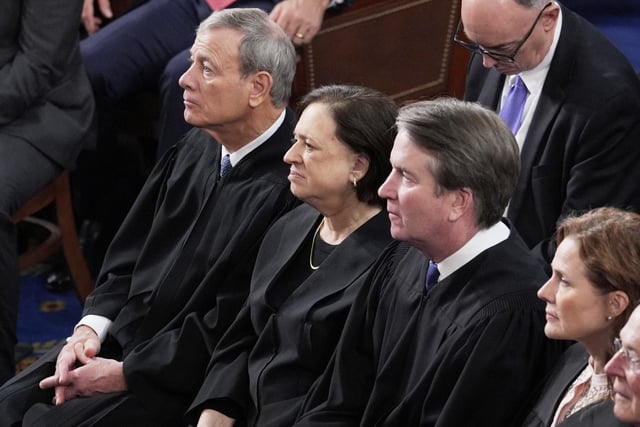 From left, Supreme Court Chief Justice John Roberts, Associate Justices Elena Kagan, Brett Kavanaugh and Amy Coney Barrett, listen as President Donald Trump addresses a joint session of Congress at the Capitol in Washington, Tuesday, March 4, 2025.