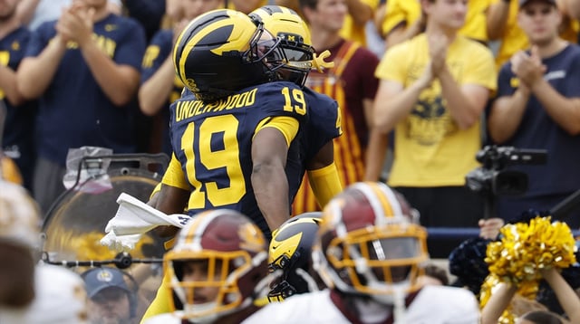 Sep 13, 2025; Ann Arbor, Michigan, USA; Michigan Wolverines quarterback Bryce Underwood (19) and wide receiver Andrew Marsh (4) celebrate a touchdown in the first half against the Central Michigan Chippewas at Michigan Stadium. Mandatory Credit: Rick Osentoski-Imagn Images