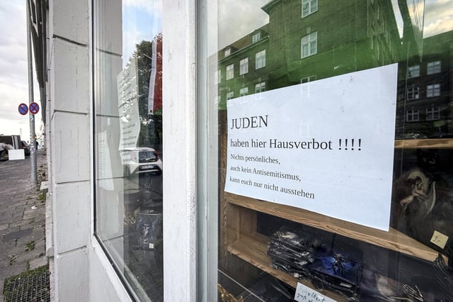 A poster saying "JEWS are banned here!!!!" hangs in a shop window in Schleswig-Holstein, Flensburg, Germany on Sept. 18, 2025. 