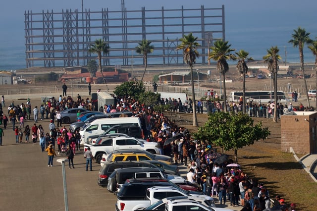 Crowds wait in line to hear Mexico President Claudia Sheinbaum speak during a rally at the Baja California Center in Rosarito, Mexico on Oct. 26, 2024. (Sandy Huffaker / For The San Diego Union-Tribune)