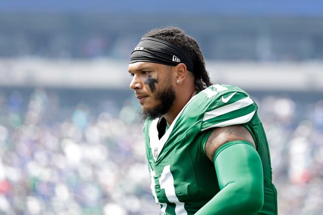 New York Jets linebacker Jermaine Johnson (11) reacts during an NFL football game against the Buffalo Bills, Sunday, Sept. 14, 2025, in East Rutherford, N.J. (AP Photo/Adam Hunger)