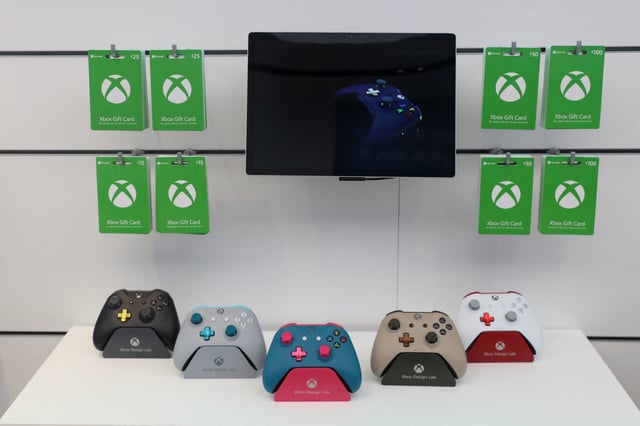 Xbox gaming controllers sit on a display shelf at Microsoft's new Oxford Circus store ahead of its opening in London, Britain July 9, 2019. Picture taken July 9, 2019. REUTERS/Simon Dawson/File Photo