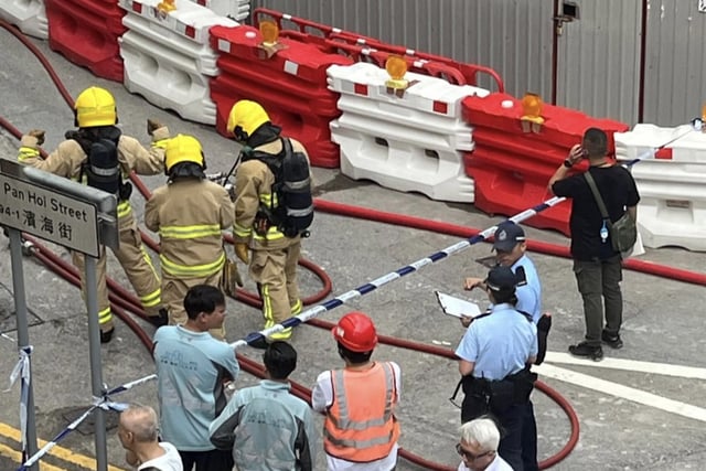Emergency personnel and officials investigate an undetonated World War II bomb that was found during construction in Hong Kong, on Sept. 19, 2025.