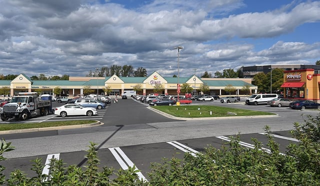 Scene near two separate shootings in Columbia Saturday. One was found dead in a car behind the office building, the other two teens were injured in the parking lot of the Giant. (Jeffrey F. Bill/Staff photo)
