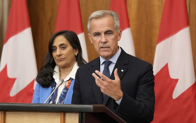FILE - Prime Minister Mark Carney speaks with media during a news conference in Ottawa, Wednesday, July 30, 2025. THE CANADIAN PRESS/Adrian Wyld