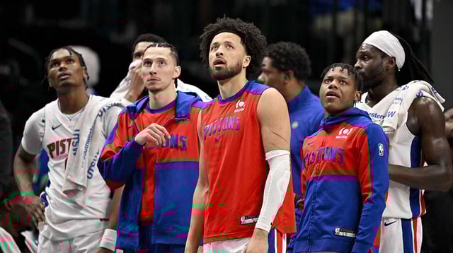 Mar 21, 2025; Dallas, Texas, USA; Detroit Pistons guard Cade Cunningham (2) and the Pistons team bench check the replay screen during the first half against the Dallas Mavericks at the American Airlines Center. Mandatory Credit: Jerome Miron-Imagn Images