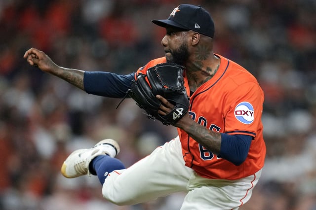 Houston Astros relief pitcher Enyel De Los Santos (65) delivers during the seventh inning of a MLB baseball game in Houston, Friday, Sept. 19, 2025.