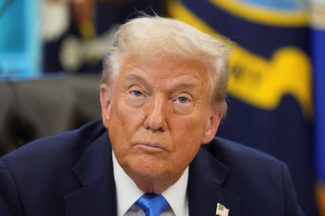 U.S. President Donald Trump looks on as he sits, in the Oval Office at the White House in Washington, D.C., U.S., September 19, 2025. REUTERS/Ken Cedeno