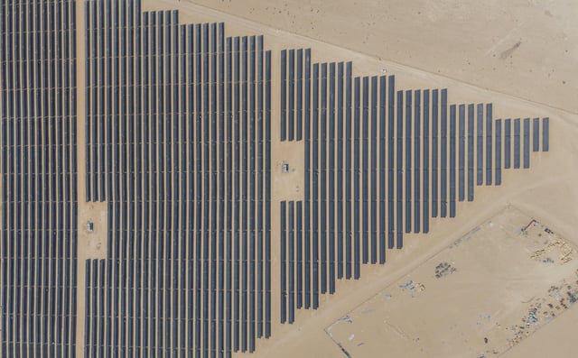 This aerial photo shows panels at a newly opened industrial-scale solar power plant in Karbala, Iraq, Wednesday, Sept. 17, 2025. (AP Photo/Anmar Khalil)