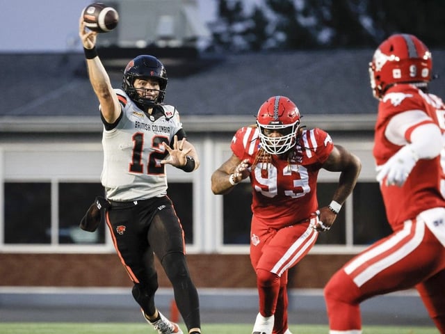 B.C. Lions quarterback Nathan Rourke, left, throws the ball as Calgary Stampeders' Charles Wiley closes in during CFL game in Calgary Sept. 19, 2025.THE CANADIAN PRESS/Jeff McIntosh