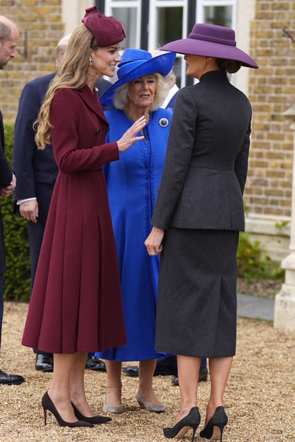 Kate Middleton, Queen Camilla, and Melania Trump chatting on the first day of the state visit. 