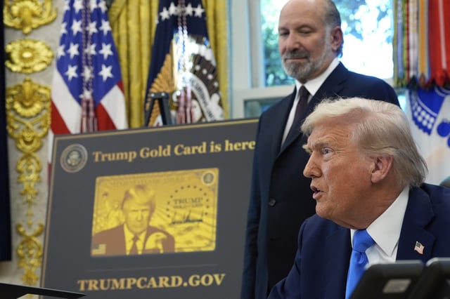 President Donald Trump speaks as Commerce Secretary Howard Lutnick listens in the Oval Office of the White House on September 19, 2025, in Washington, D.C.