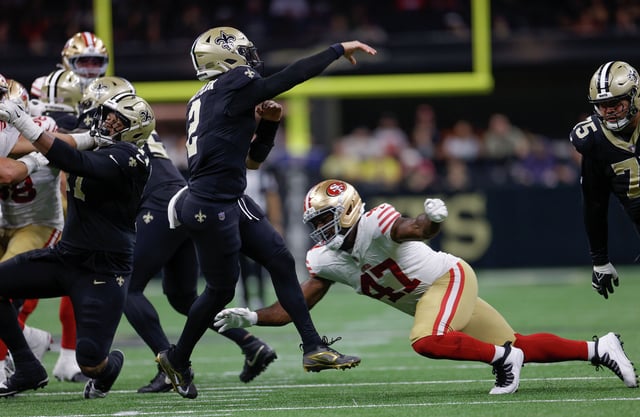 The 49ers’ Bryce Huff pressures Saints quarterback Spencer Rattler last Sunday in New Orleans. Huff had a sack and forced a fumble in the game.