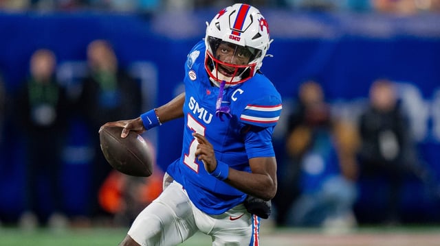 SMU quarterback Kevin Jennings (7) runs with the ball during the Atlantic Coast Conference championship NCAA college football game between Clemson and SMU Saturday, Dec. 7, 2024, in Charlotte, N.C. (AP Photo/Jacob Kupferman)