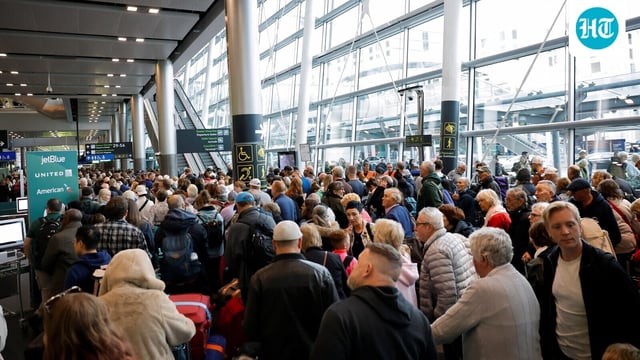 People queue inside Terminal 2 at Dublin Airport, following its reopening after it was evacuated as a safety precaution.